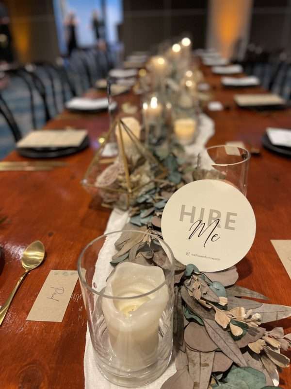 Rustic table styling. HIRE preserved foliage garland, foliage runner. candles,