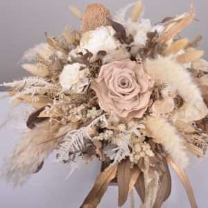 top view. centrepiece. round table. earthy nude roses, warm tones, dried and preserved flowers. hire item