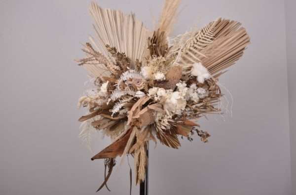 L focal floral hire piece. Lux Glamour range. earthy warm neutral tones. boho. palms and pampas.