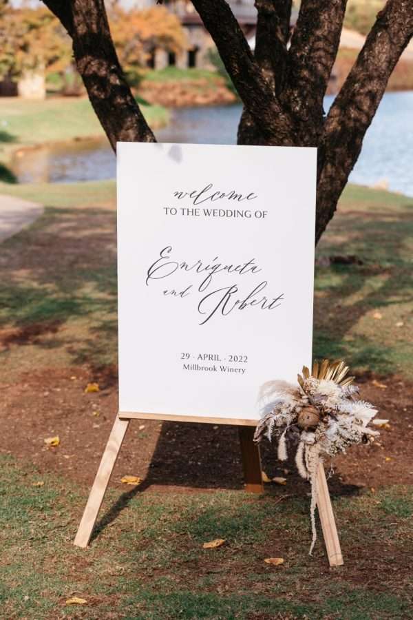 wedding ceremony sign with flowers