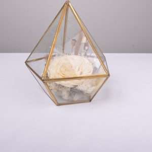small gold terrarium. table floral. hire piece. preserved flowers rose, ivory brown.