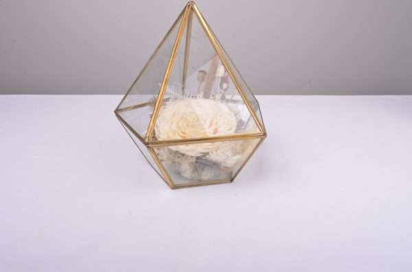 small gold terrarium. table floral. hire piece. preserved flowers rose, ivory brown.