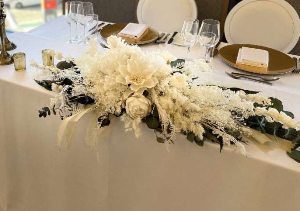 Hire wedding floral arrangements. Classic white and green wedding flowers. bridal table floral arrangement.