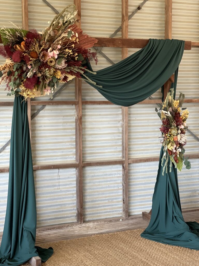 Native floral arbour, green drape